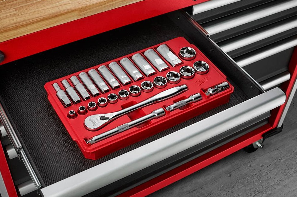 Red organizer tray with chrome SAE sockets and ratchet set in a tool chest for woodworking and home improvement tasks