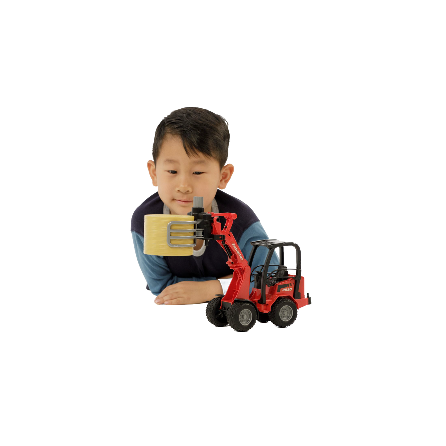 Child playing with red compact loader toy lifting round bale in Vehicles & Remote Controlled Toys collection