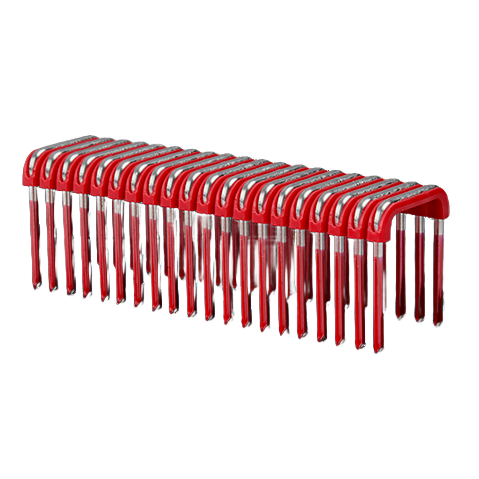 Row of red and metal insulated cable staples for securing electrical wiring in home improvement projects