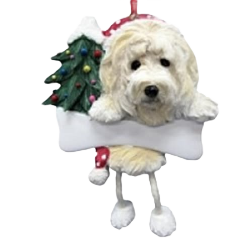 White Goldendoodle dog ornament with dangling legs and decorated Christmas tree for festive holiday decor under $50