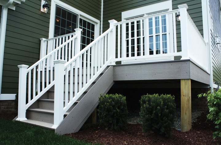 White vinyl stair rail with square balusters installed on an outdoor deck for home improvement use
