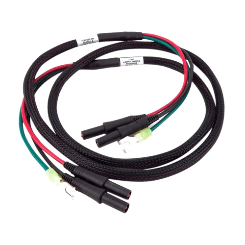 Black braided generator cables with red and green insulated wires and connectors for home improvement tools