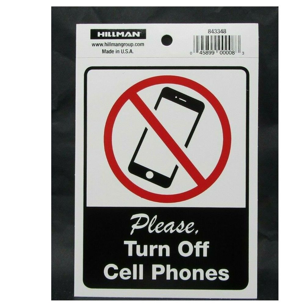White sign with red no symbol over a smartphone icon and message to turn off cell phones for home improvement use