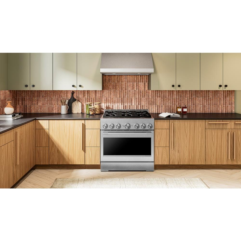 36-inch stainless steel gas range with six burners and front control knobs in a modern kitchen setting
