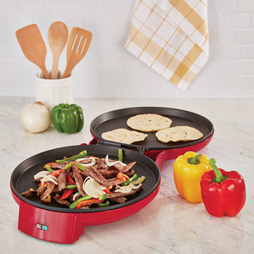 Red double electric skillet cooking sliced steak and onions with tortillas nearby for small kitchen appliances collection