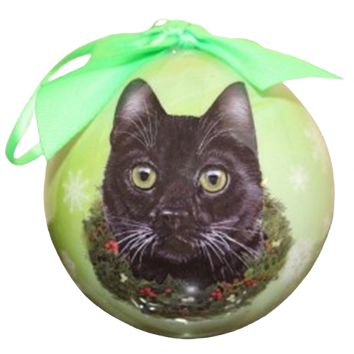 Green Christmas ball ornament with black cat face and holiday wreath design, topped with a green ribbon bow