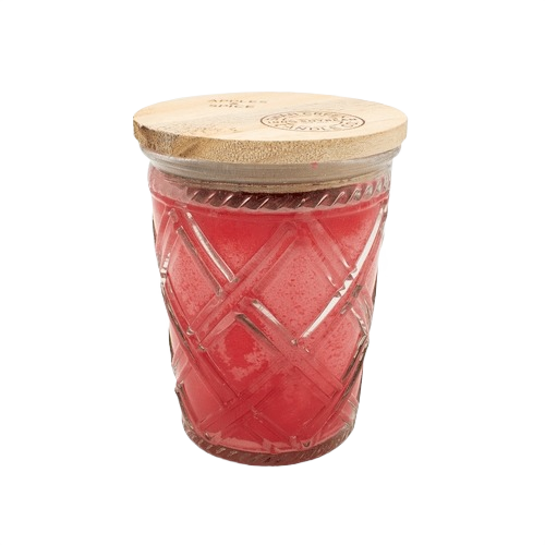 Red scented candle in patterned glass jar with natural wood lid for home ambiance and decor