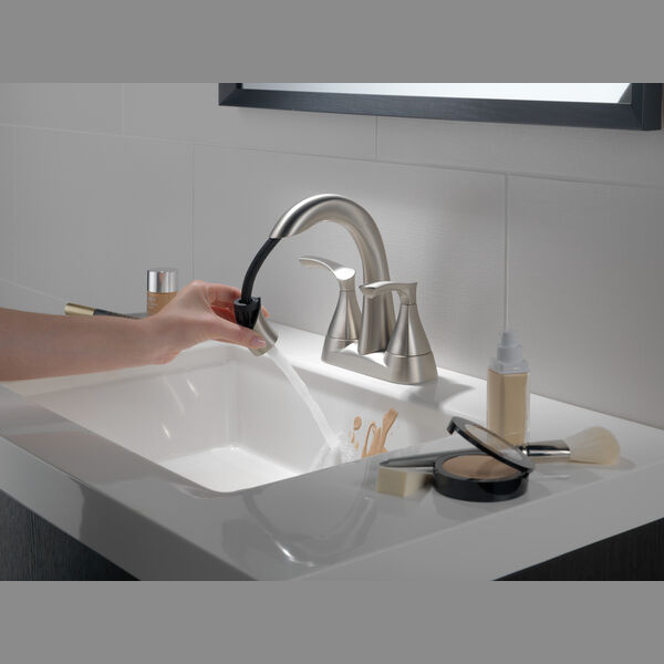 Brushed nickel two-handle centerset bathroom faucet with pull-down spout for home improvement and plumbing projects