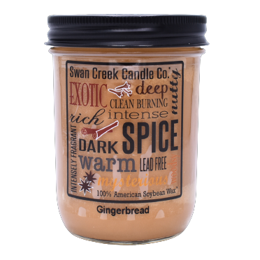 Jar candle filled with warm gingerbread-scented soy wax and black screw-on lid from Swan Creek Candle Co.