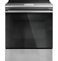 Front-control induction and convection range with platinum glass door in modern kitchen appliance setting