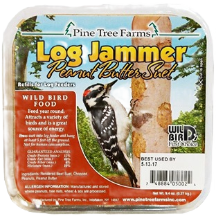 Packaging of Pine Tree Farms Log Jammer peanut butter suet featuring a woodpecker on a tree trunk illustration