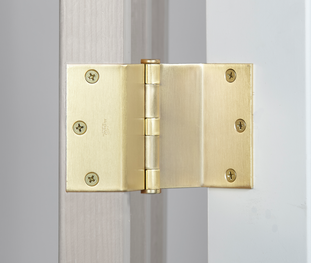 Satin brass swing hinge with ribbed design and six mounting screws for door hardware in home improvement collection