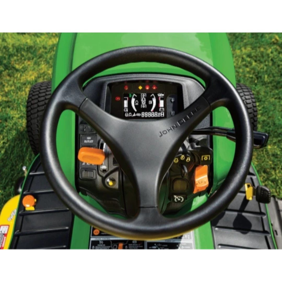 Close-up of steering wheel and digital control panel on green lawn tractor for home landscaping tasks
