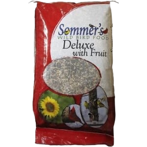 Bag of deluxe wild bird food with fruit blend shown in red and white packaging for outdoor feeding.