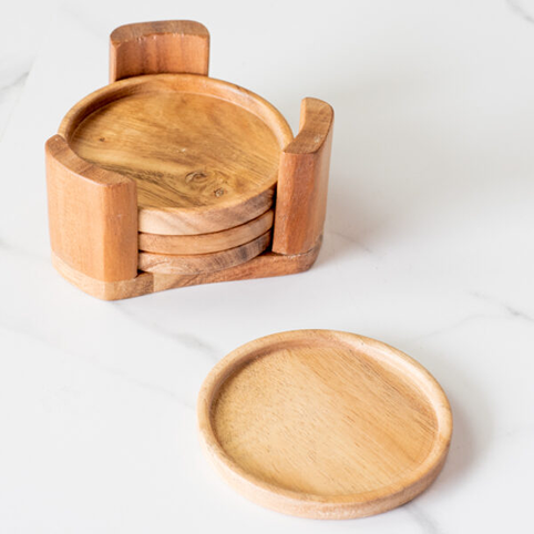 Set of natural wood round coasters with matching holder, displayed on white surface for home decor use
