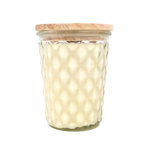 Creamy white candle in textured glass jar with natural wood lid for home fragrance and decor use
