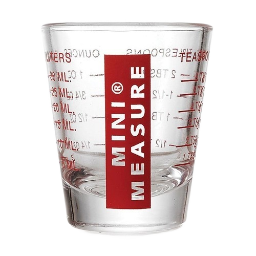 Clear food-grade glass mini measuring cup with red measurement scales for milliliters and teaspoons in kitchenware collection