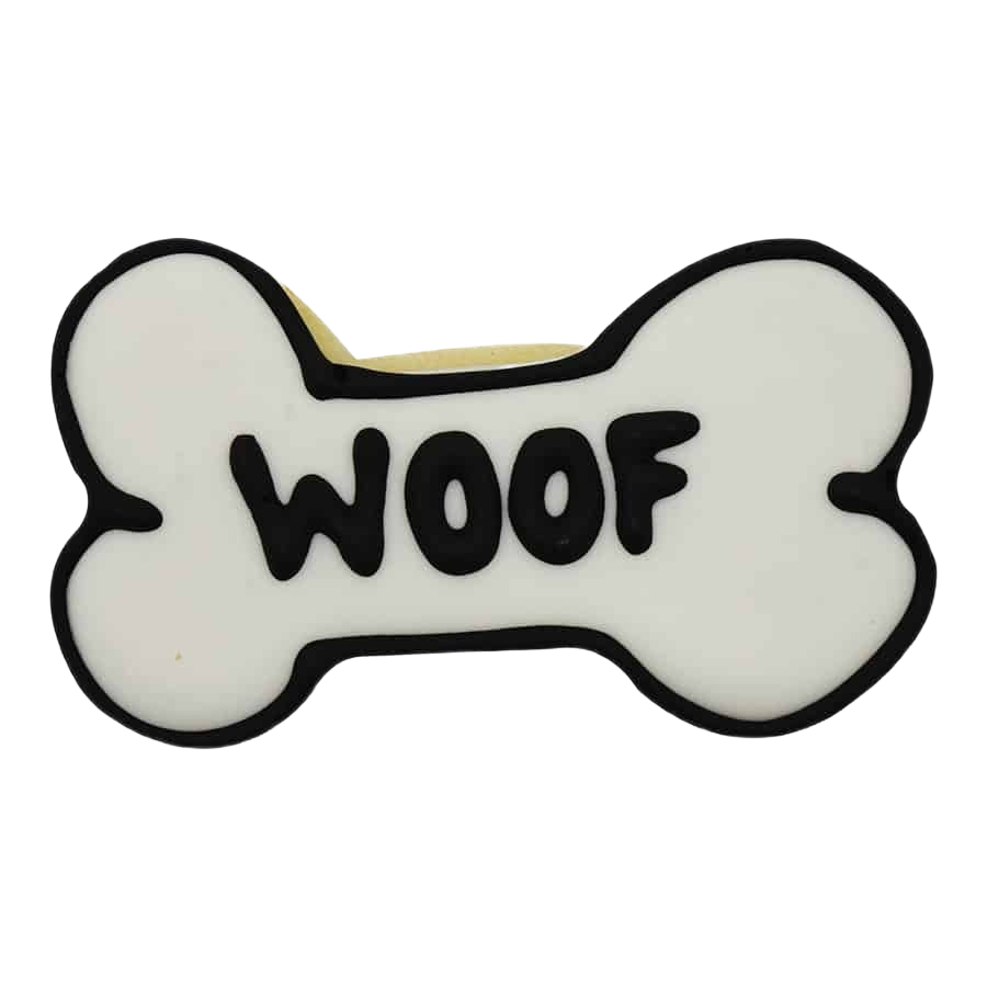 White dog bone-shaped cookie with black “WOOF” lettering for kitchenware and bakeware under $50 collections