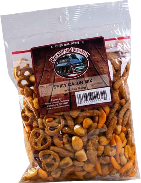 Clear resealable bag of spicy Cajun snack mix with pretzels and seasoned corn chips in Chips & Snacks collection under $25