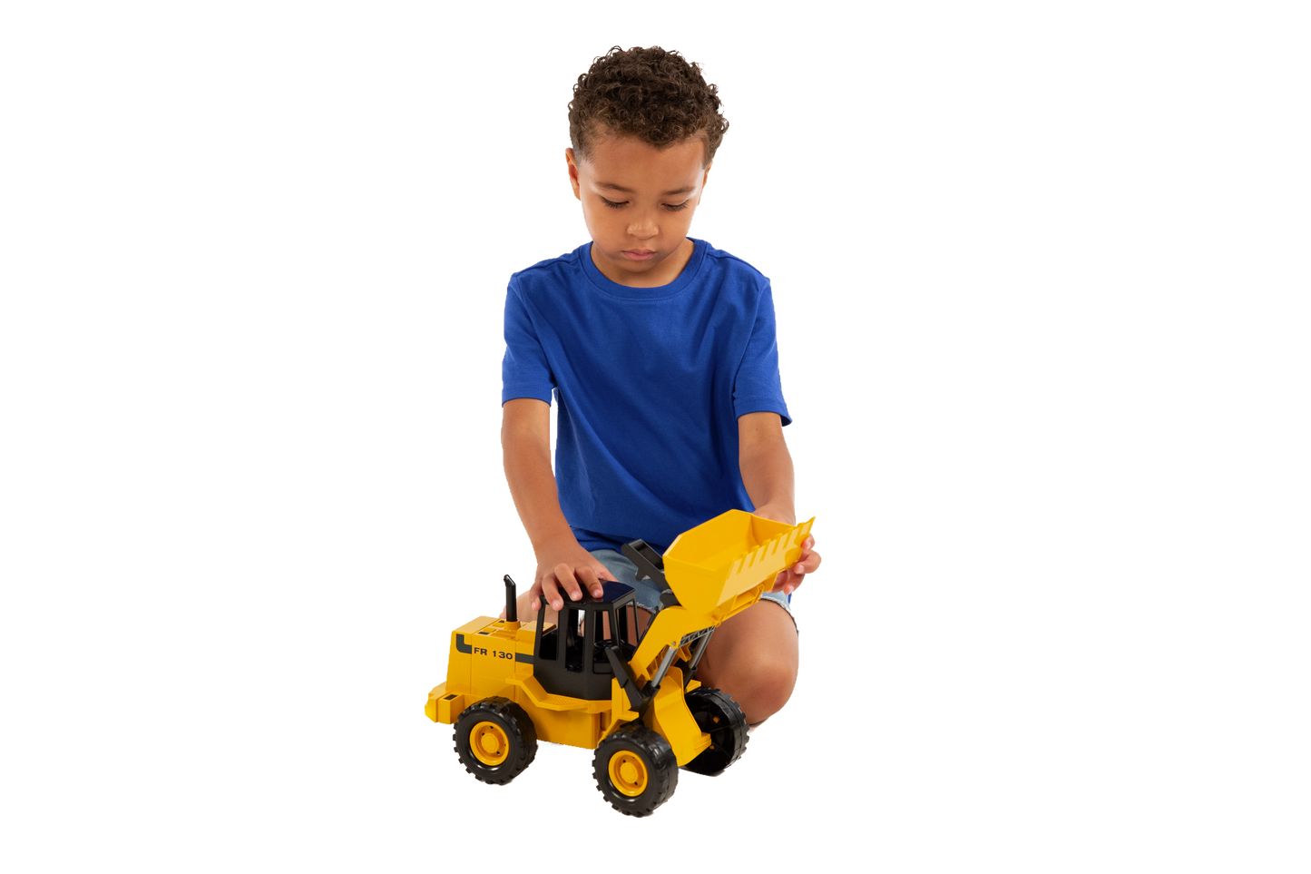 Child playing with yellow Bruder Fiat Road Loader toy with movable bucket, part of Vehicles & Remote Controlled Toys collection