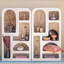 Decorative wall niche shelf with assorted pottery, dried botanicals, and hand woven rattan bowl for home accents and decor under $100