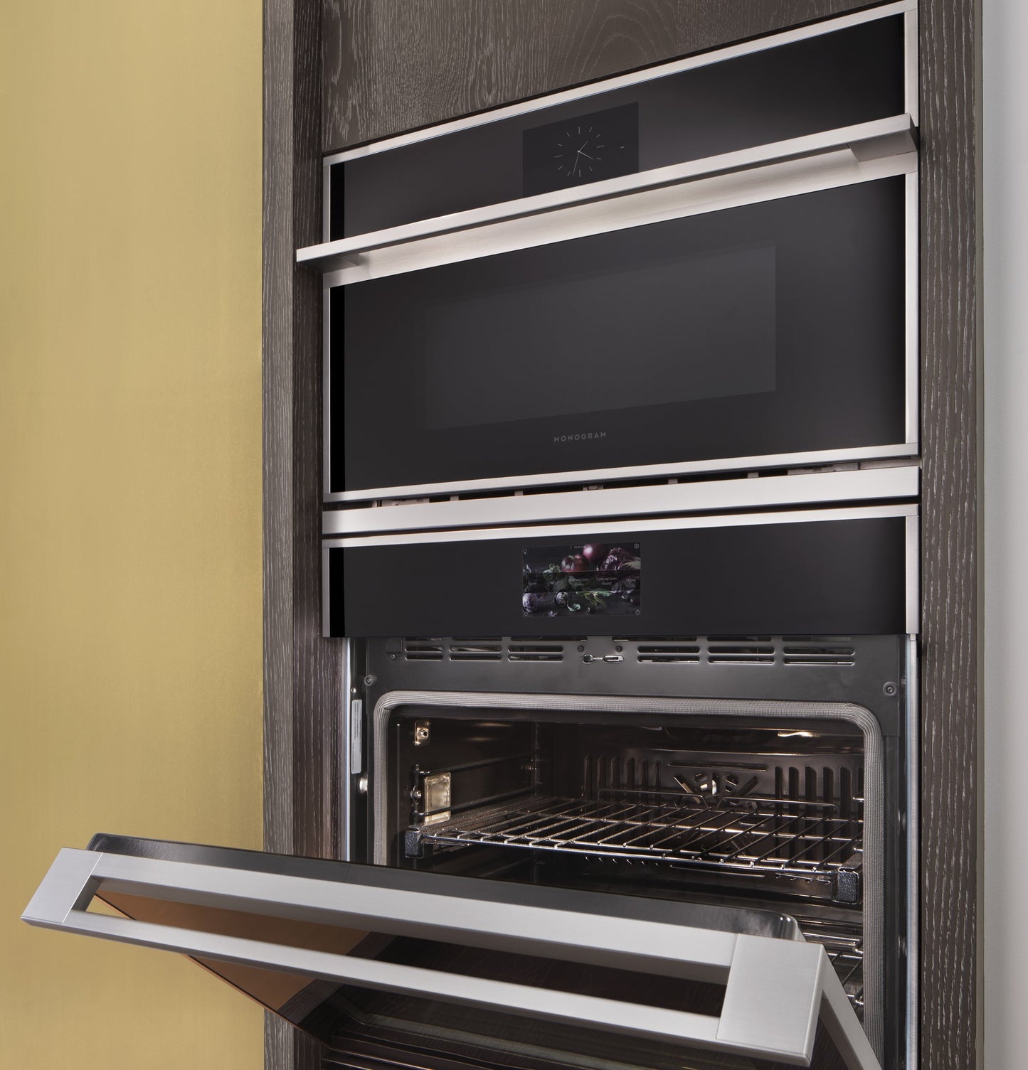 Built-in minimalist stainless steel single wall oven with digital display in modern kitchen appliances collection