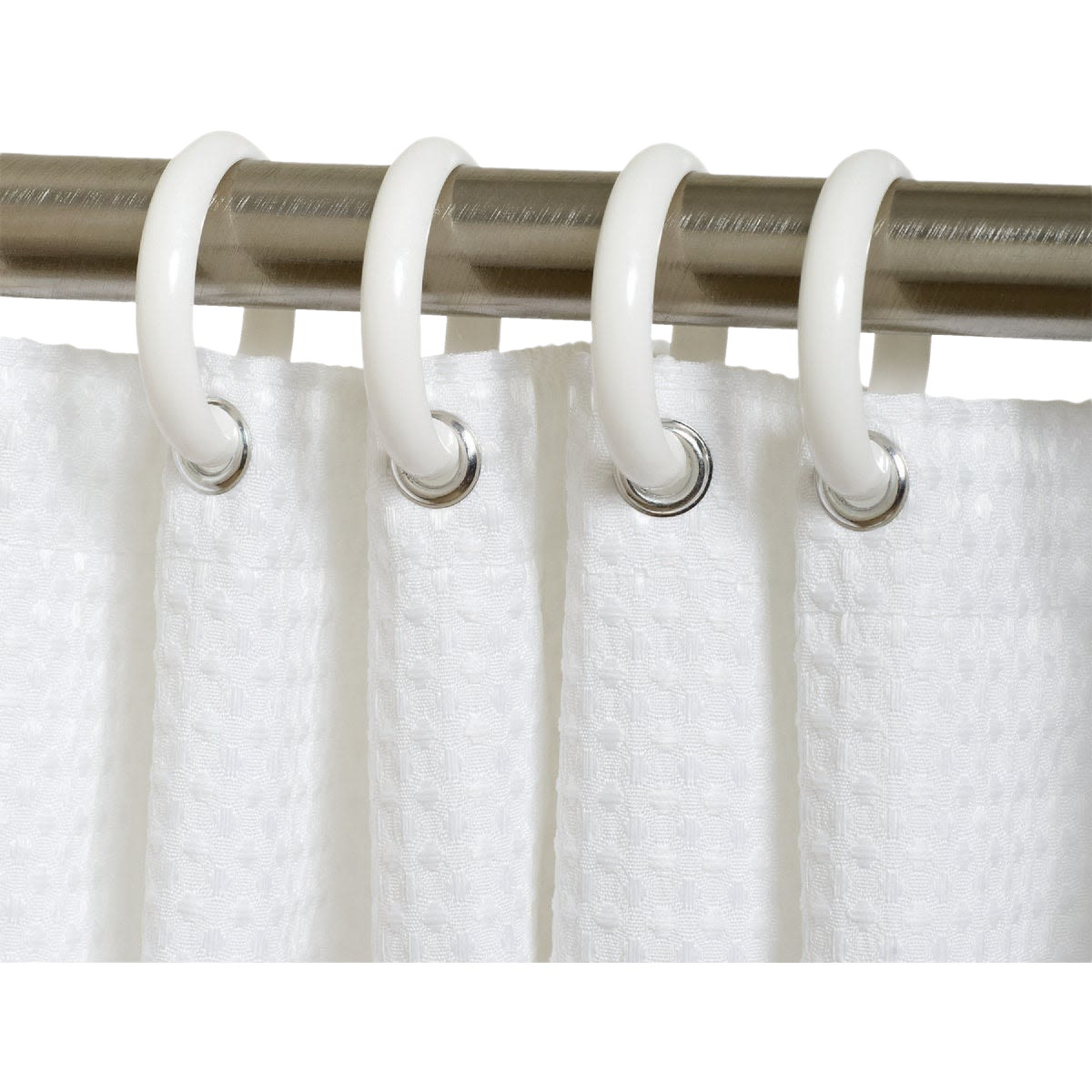 White plastic shower curtain rings hanging on brushed metal rod for bathroom and home improvement use
