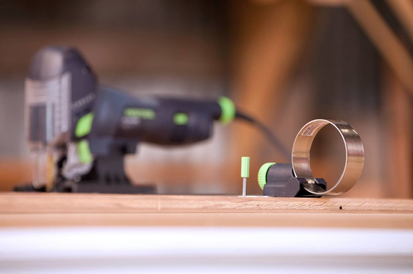 Festool jigsaw circle cutting guide with adjustable arm and metal band for precise woodworking in tool accessories and home improvement.