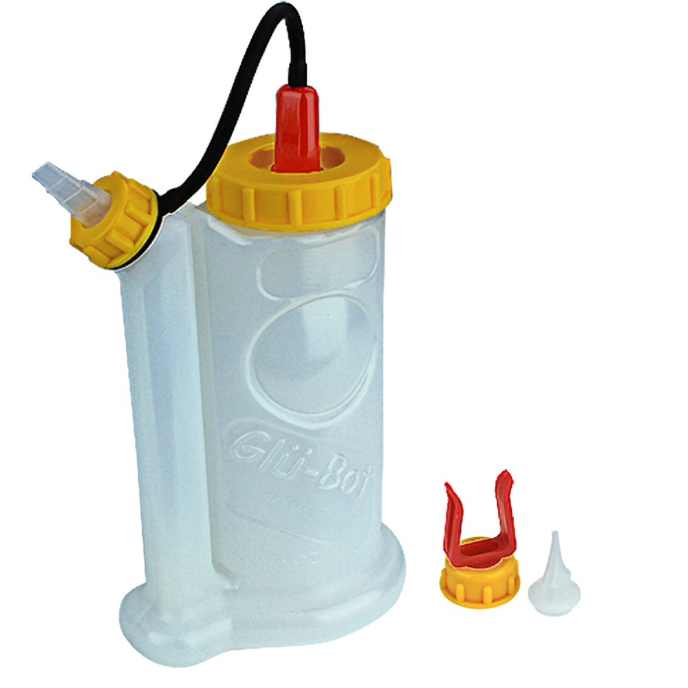 Transparent glue applicator bottle with yellow cap, red nozzle cover, and two additional glue tips for home improvement tasks