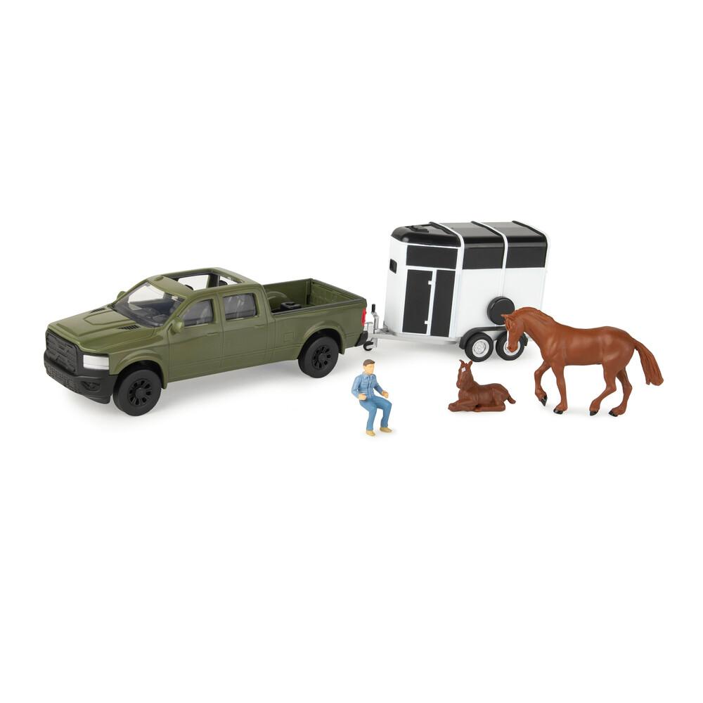 Green pickup truck toy with white horse trailer, brown horse, foal, and seated figure from toy collection