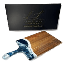 Large Acacia hardwood cheese board with navy, white, and metallic resin handle in kitchenware and under $100 collections