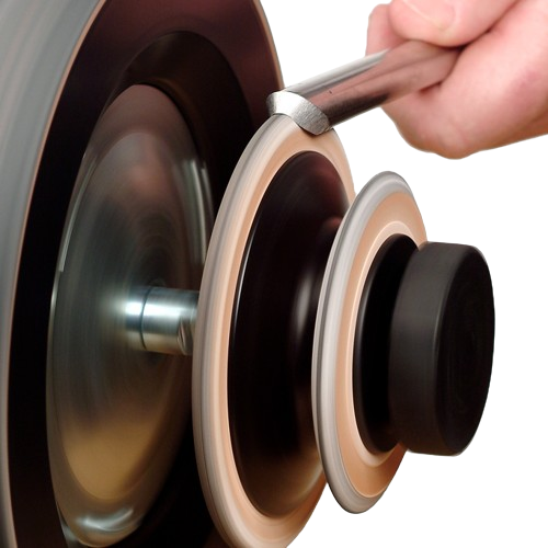 Hand holding a sharpening tool pressed against a spinning leather honing wheel for blade polishing and maintenance