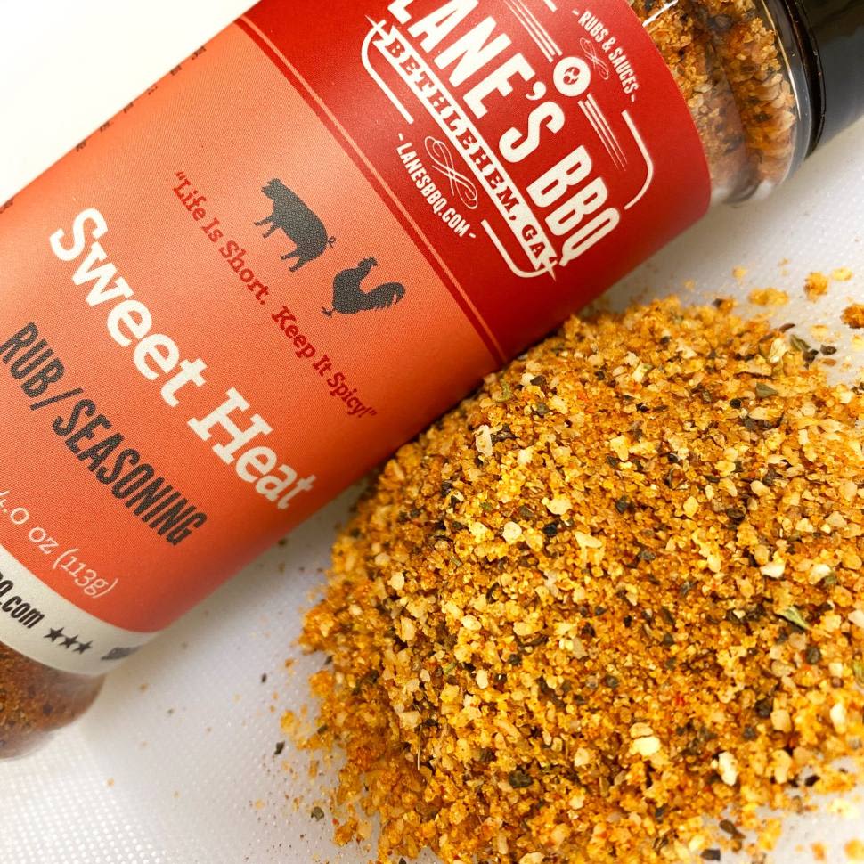 4 oz. jar of Lane's Sweet Heat Rub seasoning with a blend of sweet and spicy flavors for grilling and BBQ collections