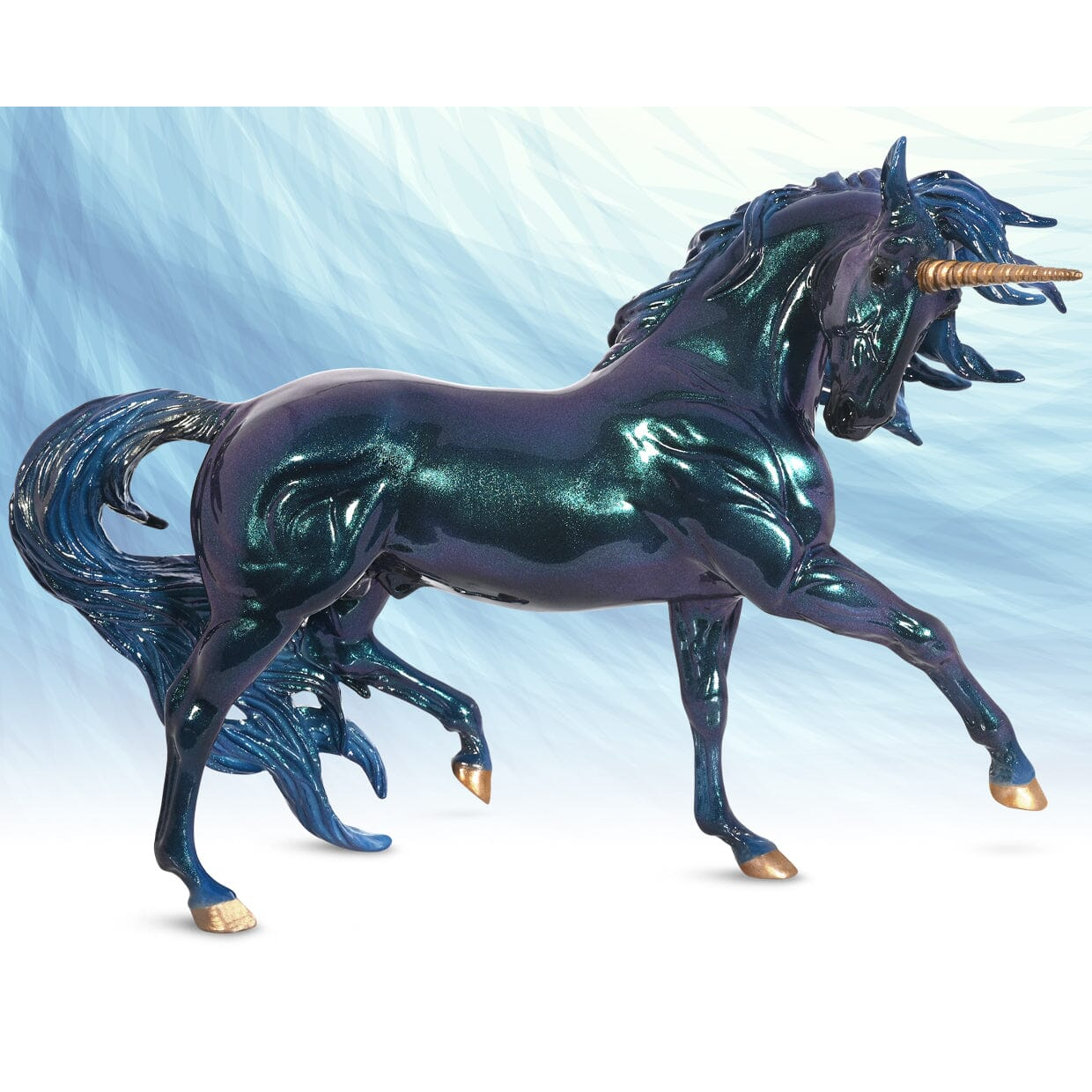 Shimmering dark blue unicorn stallion figurine with metallic gold horn and hooves in a dynamic pose