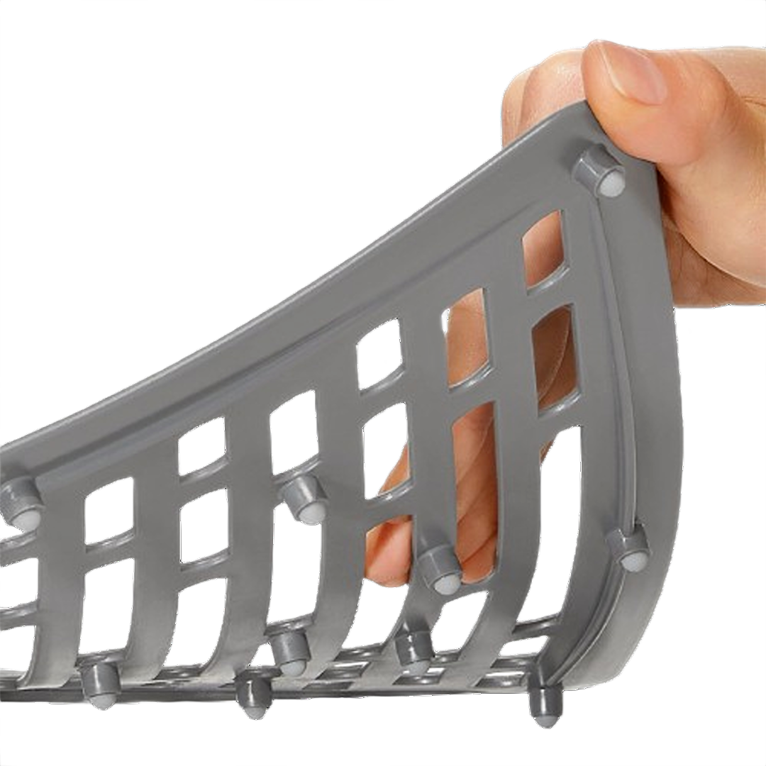 Flexible gray silicone sink mat corner with raised bumps and non-slip feet for kitchen sink protection and organization