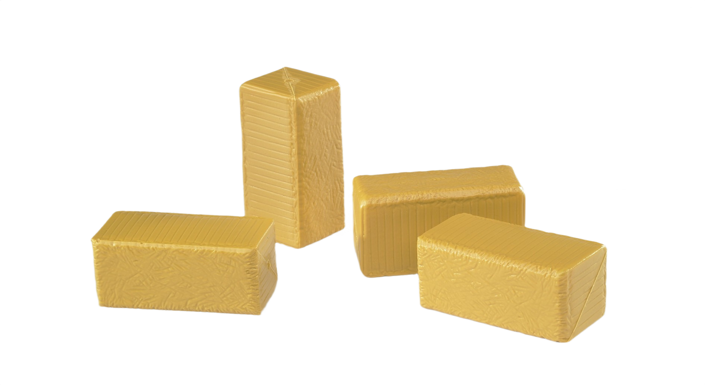 Four tan miniature hay bales in varied positions for model farming or display purposes