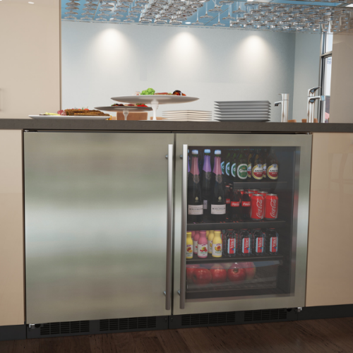 Built-in low profile beverage center with stainless steel frame, glass door, stocked with drinks and fresh produce in kitchen setting