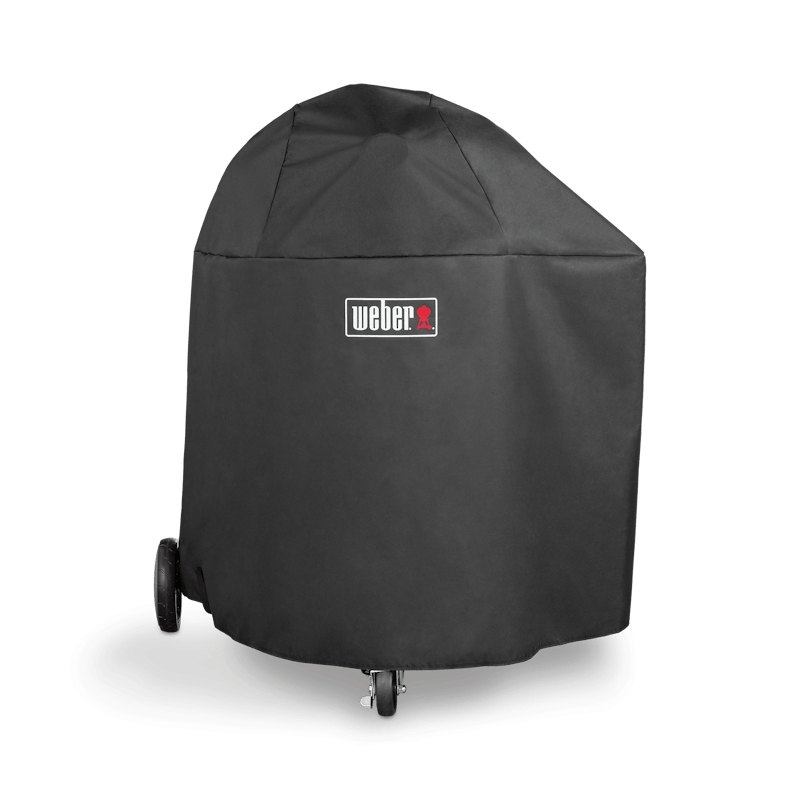 Durable black polyester grill cover protecting Summit Kamado charcoal grill in outdoor living and grill accessories collections
