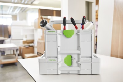 White and green Festool modular tool storage box holding hand tools for workshop organization and jobsite use