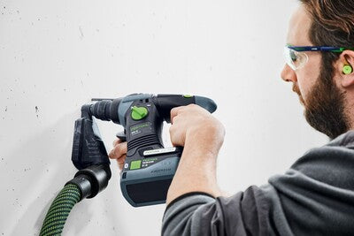 Man using cordless power drill with dust extraction attachment for home improvement and tool accessories collections