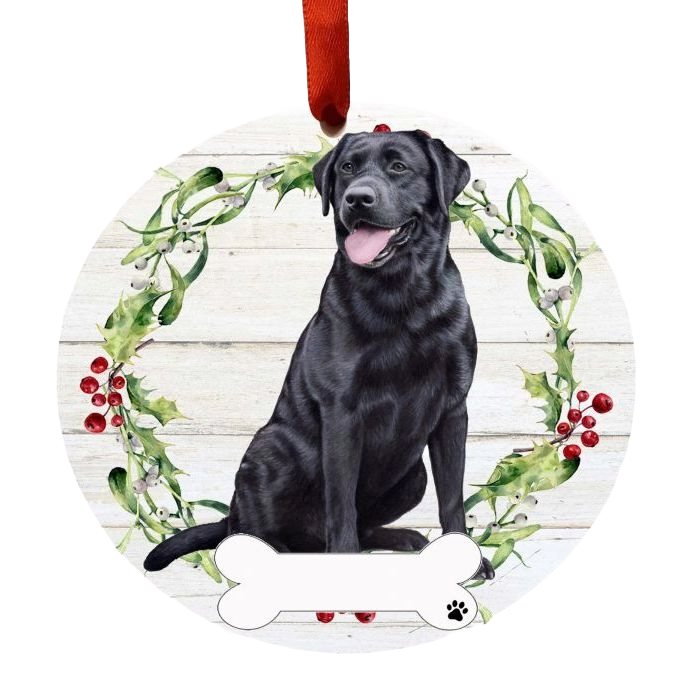 Round Christmas ornament with black Labrador illustration framed by holly wreath and red ribbon hanger