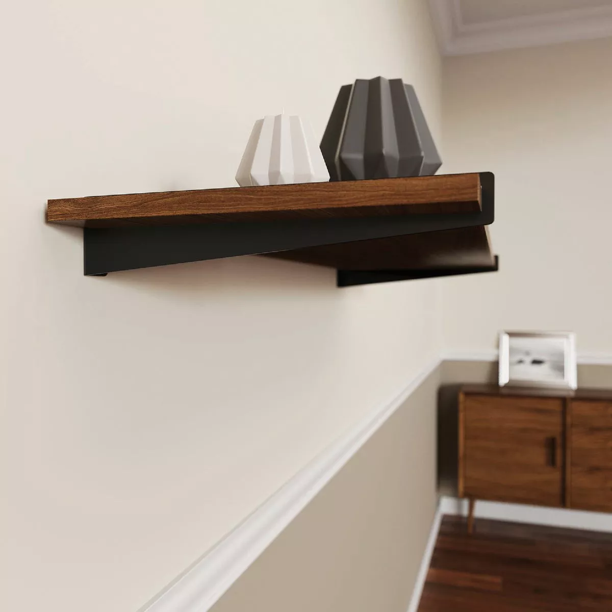 Black metal decorative shelf bracket supporting a wooden floating shelf in a modern home setting