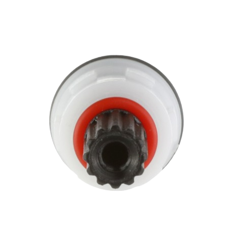 Close-up of a white and black ceramic disc cartridge with red sealing ring for plumbing repair and home improvement tools