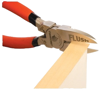 Heavy-duty pliers with orange handles trimming flush-cut nails on a wooden surface for home improvement tasks