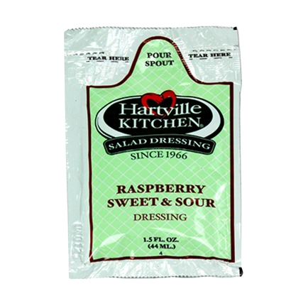 Single-use packet of Hartville Kitchen raspberry flavored sweet and sour salad dressing with easy-pour spout
