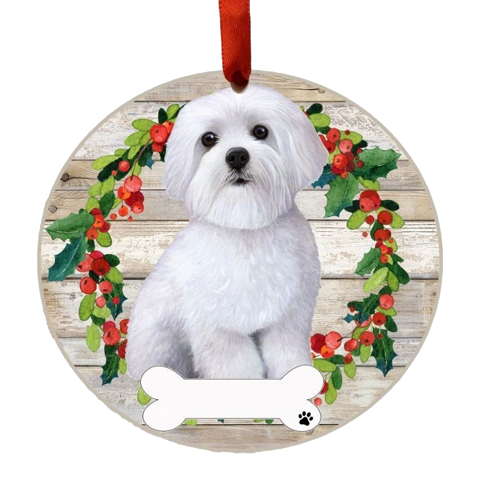 Round Christmas ornament with a white Maltese dog inside a festive holly wreath on rustic wood background