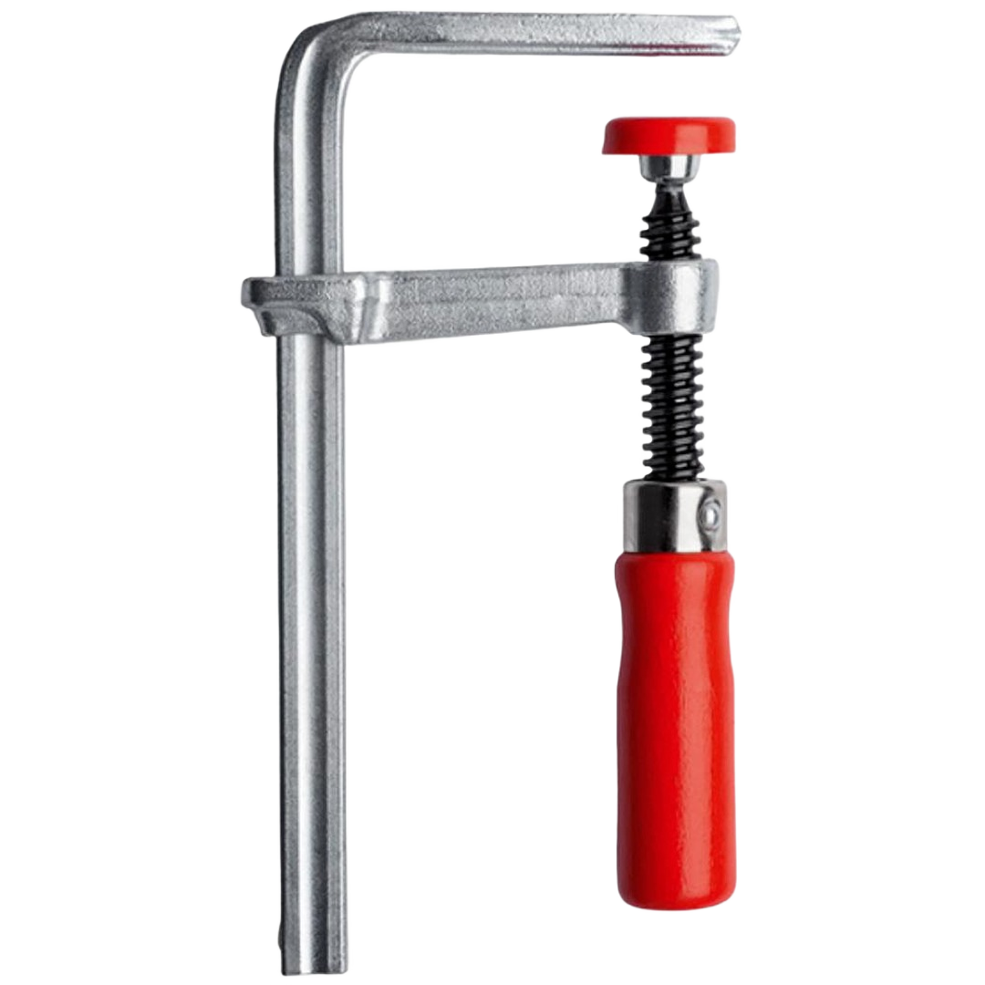 Metal track clamp featuring a red handle for securing materials in home improvement and woodworking projects