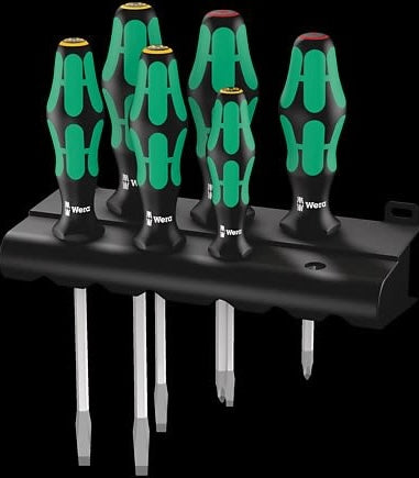 Set of six screwdrivers with ergonomic green and black handles on a black rack for tools and home improvement use