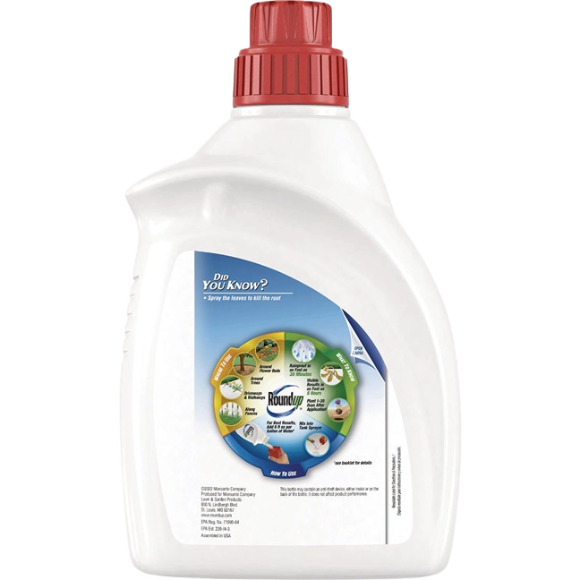 White bottle with red cap of Roundup concentrate weed and grass killer for lawn care and garden use