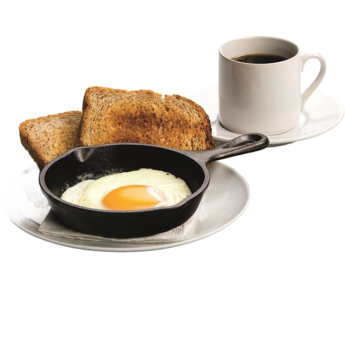Small black cast iron skillet holding a cooked sunny-side-up egg with toast and coffee cup on white plate kitchenware setting